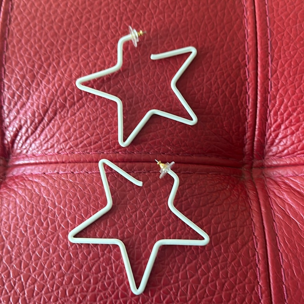 Huge white metal star pierced earrings